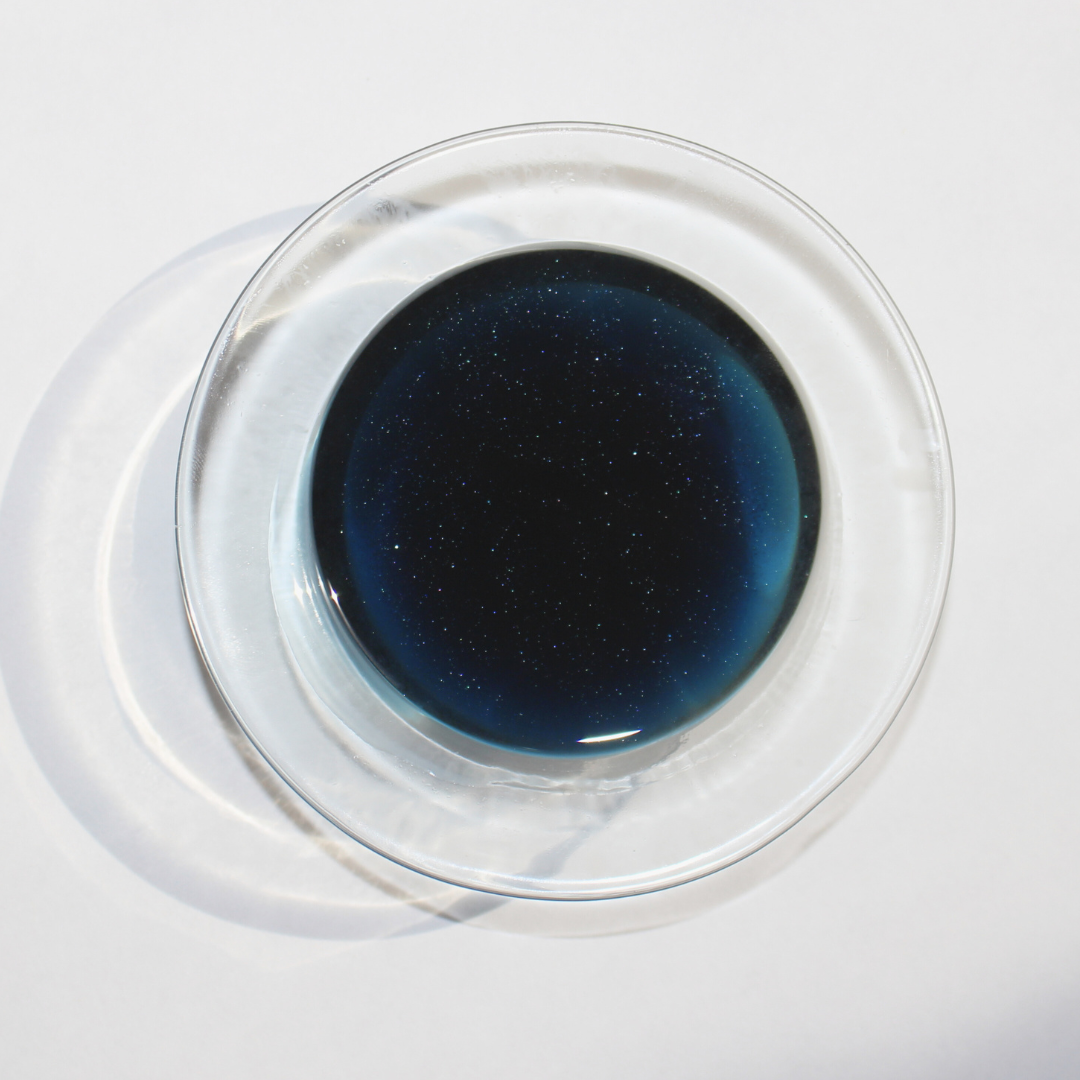 our breezy bunny wax melt completely melted you can see sparkles in the dark blue soy wax in the wax warmer