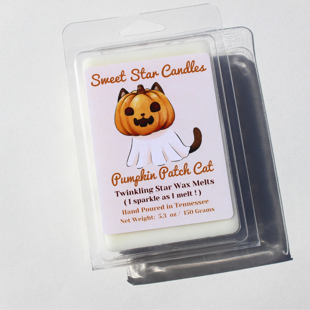 our pumpkin patch cat wax melt features white wax and a white label the label reads sweet star candles on top in orange cursive under this is our character it is a black cat with a jack o lantern on its head with ears sticking out the rest of his body is covered in a cloth ressembling a ghost with his black tail poking out under this is the title of the wax melt in orange cursive pumpkin patch cat as the scent under that it says i sparkle as i melt hand poured in east Tennessee and is 5.3 ounces or 150 gram