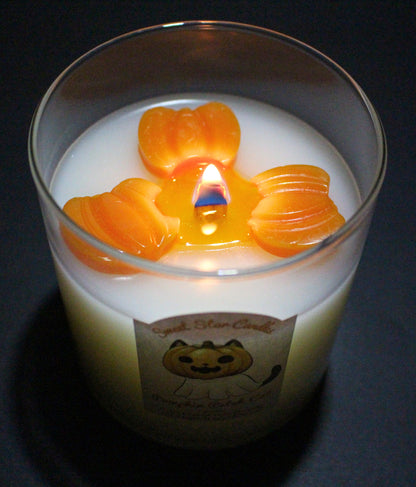 This image shows the candle burning and little sparkles can be seen around the wick in the melted wax.