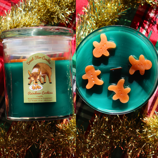 our reindeer cookies candle sits over a festive background our candle is a glass jar and glass lid the label reads sweet star candles on top in light brown cursive letters under that a reindeer eats gingerbread cookies from a plate intended for santa the reindeer is in a cute style under that it reads reindeer cookies the candle scent under that reads i sparkle as i melt hand poured in Tennessee weight 14 oz or 150 grams 