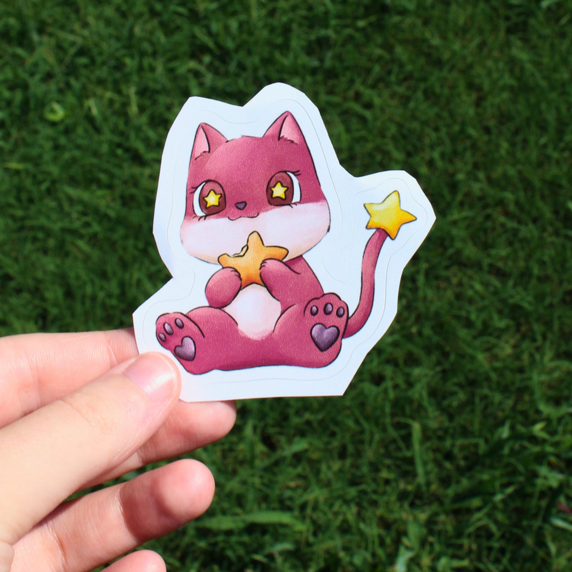 a pink alien cat eating a star shaped food