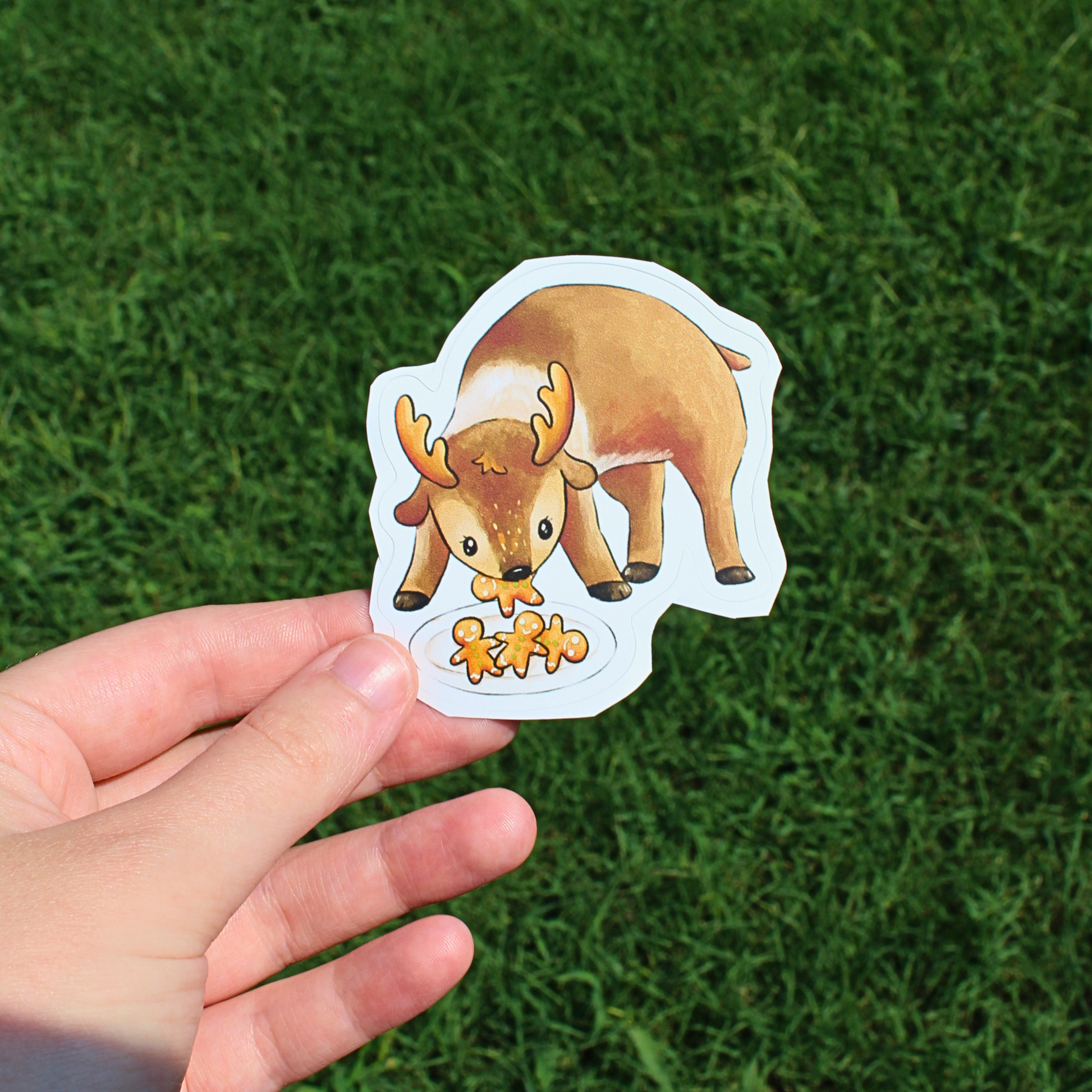 reindeer eating gingerbread cookies sticker